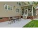 Outdoor patio with a glass table, chairs, and a view of the backyard, perfect for entertaining at 8781 Laurel Grove Ln, North Charleston, SC 29420