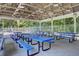 Spacious community pavilion with blue picnic tables and seating for gatherings at 8781 Laurel Grove Ln, North Charleston, SC 29420