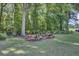 Serene picnic area with rustic wooden tables nestled amidst lush greenery at 8781 Laurel Grove Ln, North Charleston, SC 29420