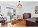 Cozy bedroom with hardwood floors, two chairs, and a decorative chest of drawers at 905 Simmons St, Mount Pleasant, SC 29464