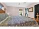 Bedroom with a large patterned bed and natural light from the window at 905 Simmons St, Mount Pleasant, SC 29464