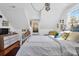 Bright bedroom with vaulted ceilings, hardwood floors, and charming decor at 905 Simmons St, Mount Pleasant, SC 29464