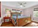 Comfortable bedroom featuring a classic wood bed frame, hardwood floors and ample natural light at 905 Simmons St, Mount Pleasant, SC 29464