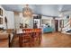 Open dining room with hardwood floors, modern lighting, large windows and stylish decor at 905 Simmons St, Mount Pleasant, SC 29464