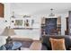 Cozy open concept kitchen with white cabinets, rug, and adjacent dining space at 905 Simmons St, Mount Pleasant, SC 29464