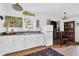 Bright kitchen features white cabinetry, window, and dining nook at 905 Simmons St, Mount Pleasant, SC 29464