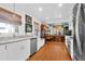 Bright kitchen with white cabinets, stainless steel appliances, and a view into the dining area at 905 Simmons St, Mount Pleasant, SC 29464
