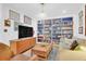 Inviting living room featuring a built-in bookcase, hardwood floors and stylish decor at 905 Simmons St, Mount Pleasant, SC 29464