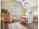 A bright bedroom features large windows and hardwood floors at 9146 Spring Branch Ct, North Charleston, SC 29406