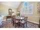 A formal dining room offers ample natural light and refined details at 9146 Spring Branch Ct, North Charleston, SC 29406