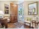 Elegant foyer boasts hardwood floors, traditional decor, and a warm, inviting atmosphere at 9146 Spring Branch Ct, North Charleston, SC 29406