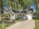 Captivating home with driveway, light siding, and a lush lawn in a serene neighborhood setting at 9146 Spring Branch Ct, North Charleston, SC 29406