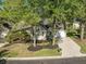 Attractive home with a manicured lawn, driveway, and light siding in a quiet neighborhood setting at 9146 Spring Branch Ct, North Charleston, SC 29406