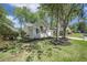 Traditional home featuring manicured front lawn, light siding, and a driveway leading to a garage at 9146 Spring Branch Ct, North Charleston, SC 29406