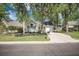Appealing home with driveway, light siding, and a manicured lawn in a peaceful neighborhood at 9146 Spring Branch Ct, North Charleston, SC 29406