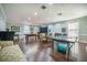 Spacious game room features a pool table, ping pong, piano, and seating area with lots of room for entertaining at 9146 Spring Branch Ct, North Charleston, SC 29406