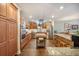 Spacious kitchen featuring wood cabinets, stainless steel appliances, and a center island perfect for food preparation at 9146 Spring Branch Ct, North Charleston, SC 29406