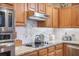 A well-appointed kitchen featuring granite countertops and stainless steel appliances at 9146 Spring Branch Ct, North Charleston, SC 29406