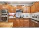Updated kitchen featuring stainless steel appliances, granite countertops, and light wood cabinets at 9146 Spring Branch Ct, North Charleston, SC 29406