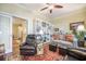 A stylish living room with a cozy atmosphere and built-in bookcase at 9146 Spring Branch Ct, North Charleston, SC 29406