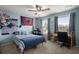 Cozy bedroom with natural light, desk area, and fun decor for youth at 9660 Godwin St, Ladson, SC 29456