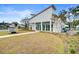 Beautiful clubhouse featuring light-filled windows, stylish architecture, and well-manicured landscaping at 9660 Godwin St, Ladson, SC 29456