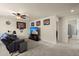 Cozy living room featuring carpet floors and a TV with decorations at 9660 Godwin St, Ladson, SC 29456