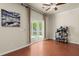 Bright living room with hardwood floors and sliding glass doors to the backyard at 9660 Godwin St, Ladson, SC 29456