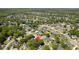 A beautiful aerial image of a suburban community featuring a serene pond and established landscaping at 99 Shadowmoss Pkwy, Charleston, SC 29414