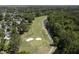 Aerial view of a golf course community with lush green fairways, water features, and beautiful homes nestled among trees at 99 Shadowmoss Pkwy, Charleston, SC 29414