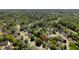 An aerial view of a lush, green neighborhood, with mature trees and well-maintained homes at 99 Shadowmoss Pkwy, Charleston, SC 29414