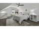 Cozy bedroom featuring a sloped ceiling, whitewashed walls, guitars, and a large patterned rug at 99 Shadowmoss Pkwy, Charleston, SC 29414
