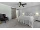 Cozy bedroom featuring a sliding barn door, ceiling fan, and comfortable furnishings at 99 Shadowmoss Pkwy, Charleston, SC 29414