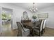 Cozy dining room with a rustic wooden table, chandelier, and stylish decor at 99 Shadowmoss Pkwy, Charleston, SC 29414