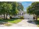 Beautiful two-story home with a spacious driveway, manicured lawn, and inviting front porch, exuding curb appeal at 99 Shadowmoss Pkwy, Charleston, SC 29414