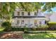 Charming two-story home with a welcoming front porch and beautifully landscaped front yard at 99 Shadowmoss Pkwy, Charleston, SC 29414