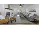 Bright living room with a comfortable sofa, fireplace, and doors leading to the outdoor area at 99 Shadowmoss Pkwy, Charleston, SC 29414