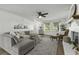 Cozy living room with fireplace, plush seating, and plenty of natural light at 99 Shadowmoss Pkwy, Charleston, SC 29414