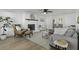Inviting living room featuring a cozy fireplace, stylish furnishings, and ample natural light at 99 Shadowmoss Pkwy, Charleston, SC 29414