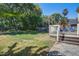 Sprawling backyard featuring a wooden deck, lush green lawn, and privacy fence at 101 N Warwick Trce, Goose Creek, SC 29445