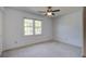 Bright bedroom with neutral carpet features a ceiling fan and double-hung windows at 101 N Warwick Trce, Goose Creek, SC 29445