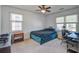 Cozy bedroom with carpet features two double hung windows and an office desk at 101 N Warwick Trce, Goose Creek, SC 29445