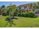 Charming two-story home with mature trees and landscaped yard with front porch at 101 N Warwick Trce, Goose Creek, SC 29445