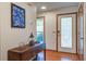 Inviting foyer with hardwood floors and decorative light fixture at 101 N Warwick Trce, Goose Creek, SC 29445