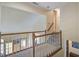 Upstairs hallway with carpet and wood banister at 101 N Warwick Trce, Goose Creek, SC 29445