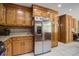 Kitchen showcases a stainless steel refrigerator, granite countertops, and plenty of wood cabinet storage space at 101 N Warwick Trce, Goose Creek, SC 29445