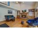 Comfortable living room with fireplace, hardwood floors, vaulted ceilings, and cozy furniture at 101 N Warwick Trce, Goose Creek, SC 29445