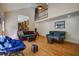 Inviting living room featuring hardwood floors, comfortable seating, and a view of the kitchen at 101 N Warwick Trce, Goose Creek, SC 29445