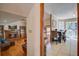 Cozy view of living spaces featuring hardwood floors, fireplace, view of dining area, and natural light at 101 N Warwick Trce, Goose Creek, SC 29445