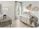 Comfortable bedroom with a bed, desk, and window with natural light at 1024 Sagegrass St, Summerville, SC 29485